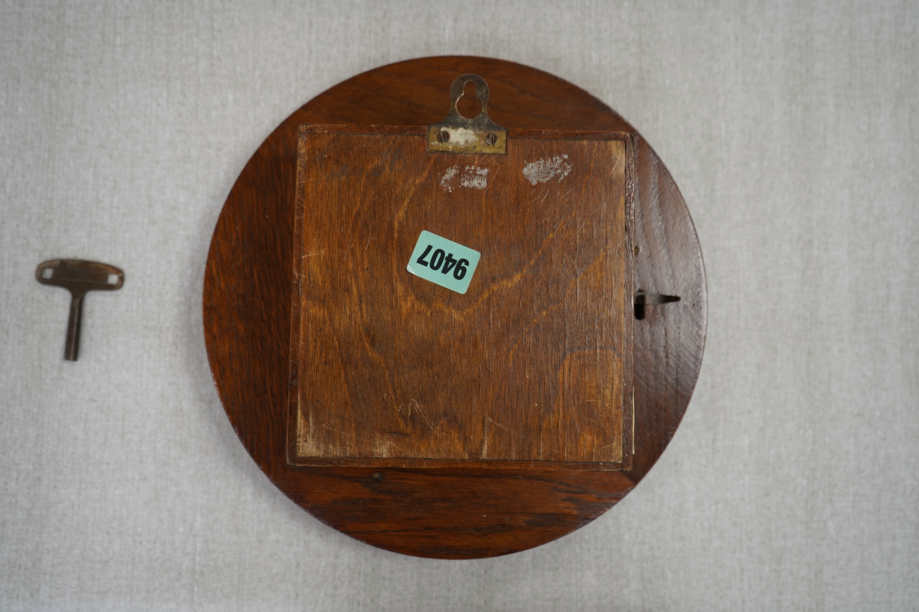 A GWR mahogany wall timepiece by Smiths, Made in Great Britain, with 8” painted dial marked Cardiff and separate seconds dial within the chapter ring, platform escapement, ivorine plaque engraved with ‘BR-WR 3952’ to the